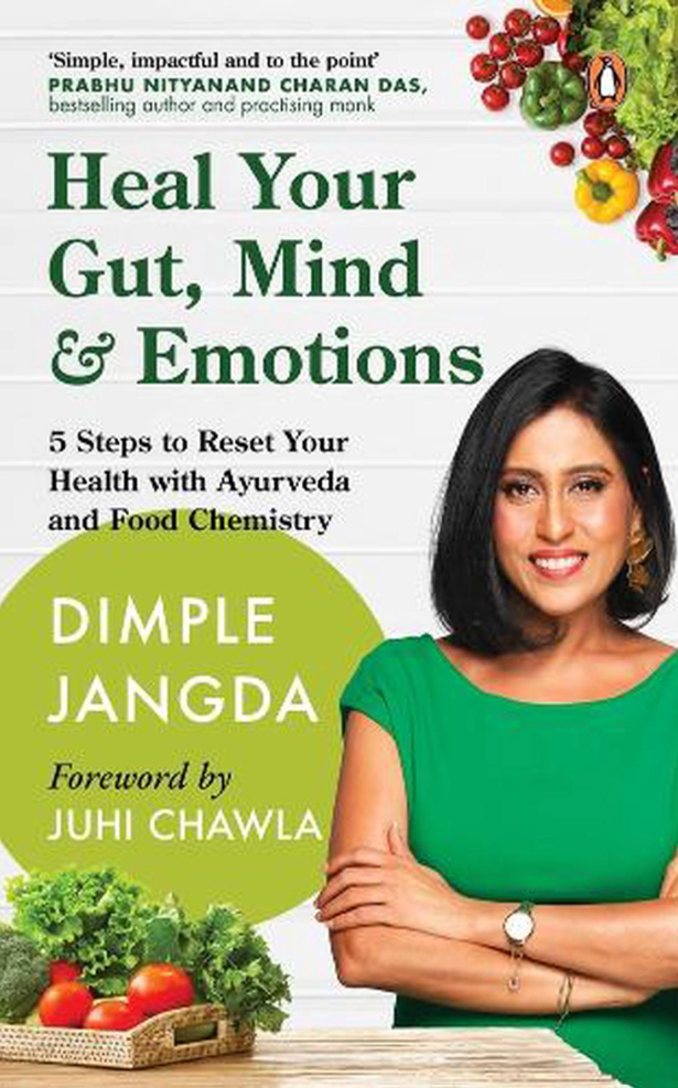 Book cover of 'Heal Your Gut, Mind & Emotions' by Dimple Jangda with a woman in a green dress and vegetables on a white background.